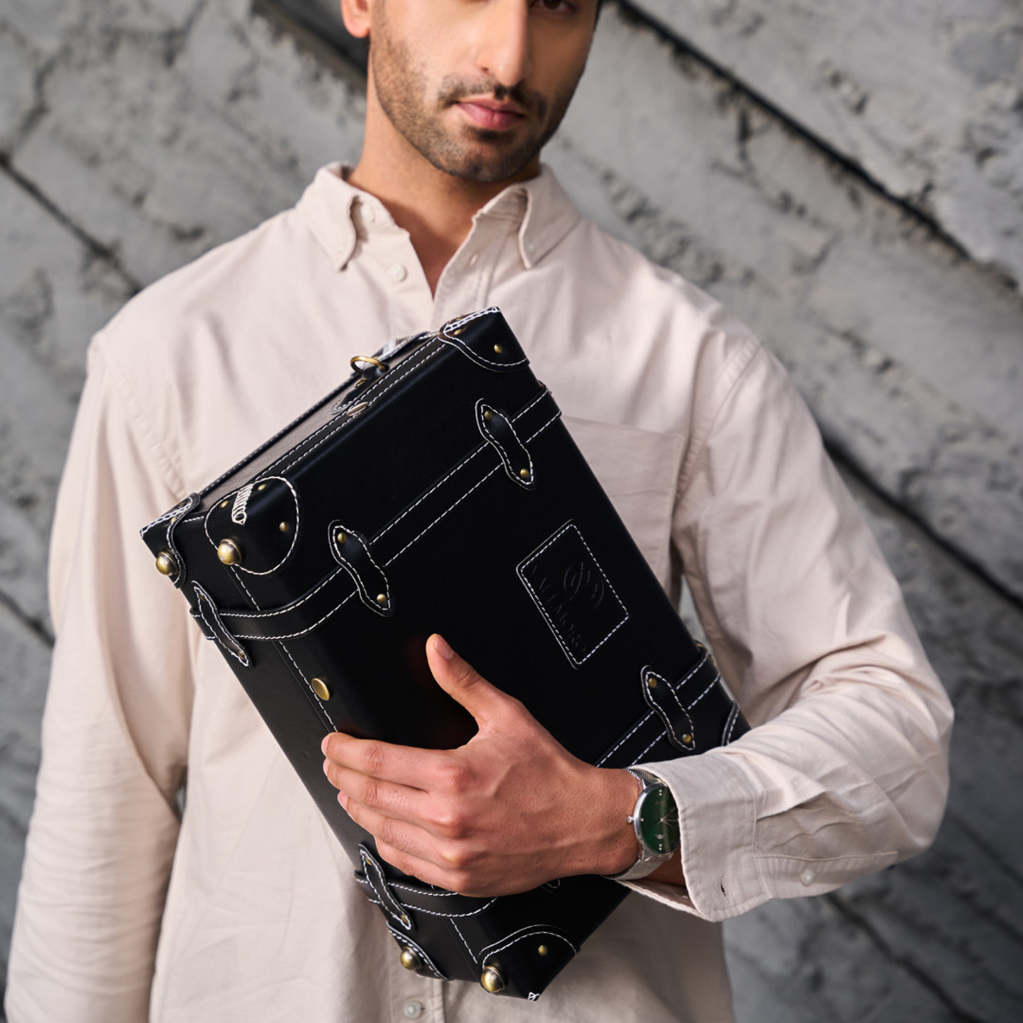 compact hard shell luggage with textile exterior finish detail