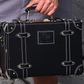 compact hard shell luggage with vegan leather exterior finish detail
