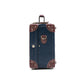 compact hard shell luggage with vegan leather exterior finish detail