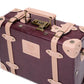 compact hard shell luggage with vegan leather exterior finish detail