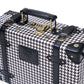 compact hard shell luggage with vegan leather exterior finish detail